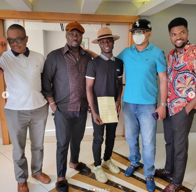 Obi Cubana presents scholarship letter to Lagos hawker